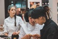 Young cooks working at Tuttofood 2015 in Milan, Italy