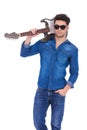 Young cool guitarist holding guitar on his shoulder Royalty Free Stock Photo