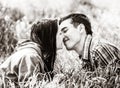 Copule of man and woman on grass in a park