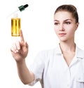 Young cosmetologist woman presents cosmetics oil.