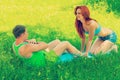Young coumple exercizing on grass in park instagram stile Royalty Free Stock Photo