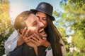 Boyfriend carrying his girlfriend on piggyback. Royalty Free Stock Photo