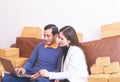 Young couple addicted to online shopping