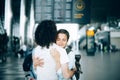 Young couple at the airport departure area saying goodbye Royalty Free Stock Photo