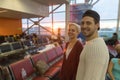 Young Couple In Airport Lounge Waiting Departure Happy Smile Man And Woman Royalty Free Stock Photo