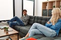 Young couple angry sitting on the sofa in silence at home