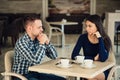 Young couple arguing in a cafe. Relationship problems. Royalty Free Stock Photo