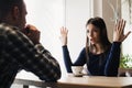 Young couple arguing in a cafe. Relationship problems. Royalty Free Stock Photo