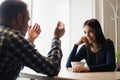 Young couple arguing in a cafe. Relationship problems. Royalty Free Stock Photo