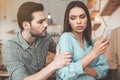 Young couple arguing in cafeteria