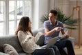 Young couple arguing about high bills with laptop and documents Royalty Free Stock Photo