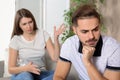 Young couple arguing in living room. Royalty Free Stock Photo