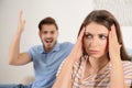 Young couple arguing in living room. Royalty Free Stock Photo