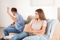 Young couple arguing in living room. Royalty Free Stock Photo