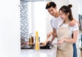 Young couple asian together man and woman cooking food for dinner salad Royalty Free Stock Photo