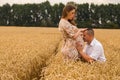 Young couple awaiting baby among the wheat field Royalty Free Stock Photo