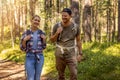 Young couple Ã¢ÂÂ¬with backpacks on a hike in forest. backpacking trip, summer adventure vacation Royalty Free Stock Photo