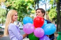 Young couple with balloons in the park. Royalty Free Stock Photo