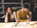 Young couple at the bar. Concept of betrayal