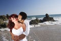 Young Couple at the beach kissing Royalty Free Stock Photo