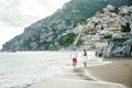 Young couple on the beach of Positano, Amalfi Coast, Italy Royalty Free Stock Photo