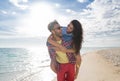 Young Couple On Beach Summer Vacation, Happy Smiling Man Carry Woman Back Seaside