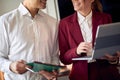 Young couple in the hotel room preparing for a meeting at their business trip for a new deal. Hotel, business, people Royalty Free Stock Photo