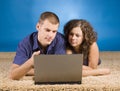 Young couple on beige carpet