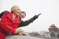 Young Couple In Beijing In Winter, Pointing off Screen Royalty Free Stock Photo