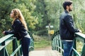 Young couple being in a conflict in the park. Royalty Free Stock Photo