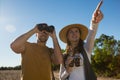 Young couple with binoculars at forest Royalty Free Stock Photo