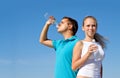 Young couple with bottles of water Royalty Free Stock Photo
