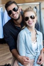 beautiful happy young couple in sunglasses smiling at camera Royalty Free Stock Photo