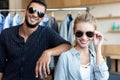 happy young couple in sunglasses smiling at camera Royalty Free Stock Photo