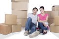 Young couple with boxes on studio Royalty Free Stock Photo