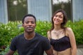 young couple boyfriend and girlfriend smiling together looking at the camera