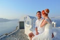 Young couple bride and groom celebrate wedding on Santorini