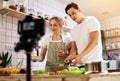 Young couple broadcast live VLOG social media in the dining room while working from home. COVID-19 Royalty Free Stock Photo