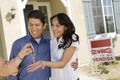 Young couple buying house taking keys Royalty Free Stock Photo