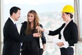 Young couple buying new home with estate agent Royalty Free Stock Photo