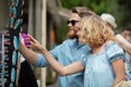 young couple buying new sunglasses outdoor Royalty Free Stock Photo