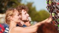 Young couple buying new sunglasses outdoor Royalty Free Stock Photo