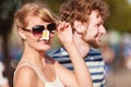 Young couple buying new sunglasses outdoor Royalty Free Stock Photo