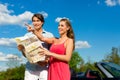 Young couple with cabriolet in summer on day trip Royalty Free Stock Photo