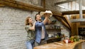 Young couple caking pizza in kitchen together Royalty Free Stock Photo