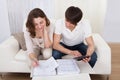 Young couple calculating budget Royalty Free Stock Photo