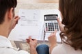 Young couple calculating budget Royalty Free Stock Photo