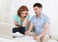 Young couple calculating budget Royalty Free Stock Photo