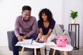 Young Couple Calculating Invoice Royalty Free Stock Photo