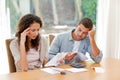 Young couple calculating their domestic bills Royalty Free Stock Photo